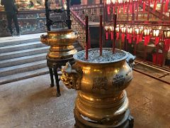 05D Incense and two large gold urns pots with red Chinese lanterns in Man Mo Temple Hong Kong